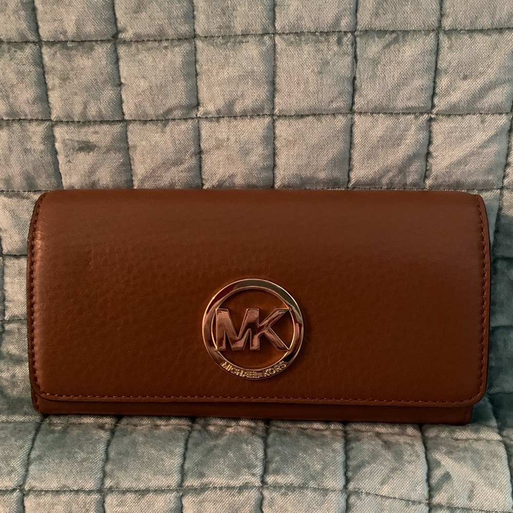 Micheal Kors tan leather wallet.